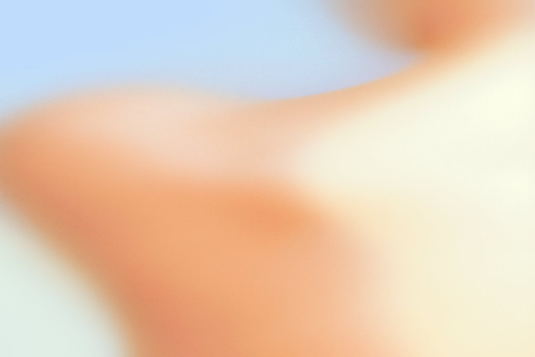 Blurred abstract gradient of orange and yellow on a light blue background